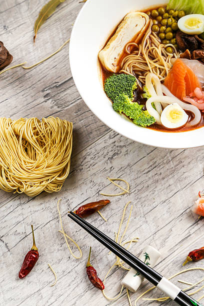 istock Soup with seafood, noodles and vegetables in a white plate 614952502