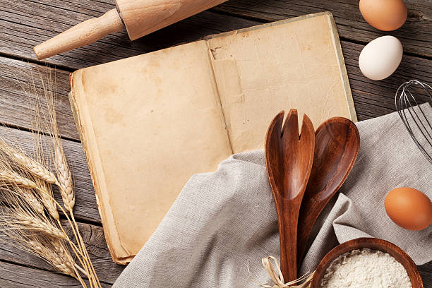 istock Vintage recipe book, utensils and ingredients 614954316