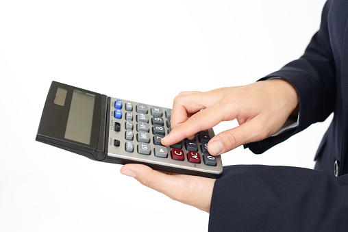 Close up of woman's hands is using calculator business, Education concept