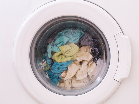 Full loaded washing machine. Close up.