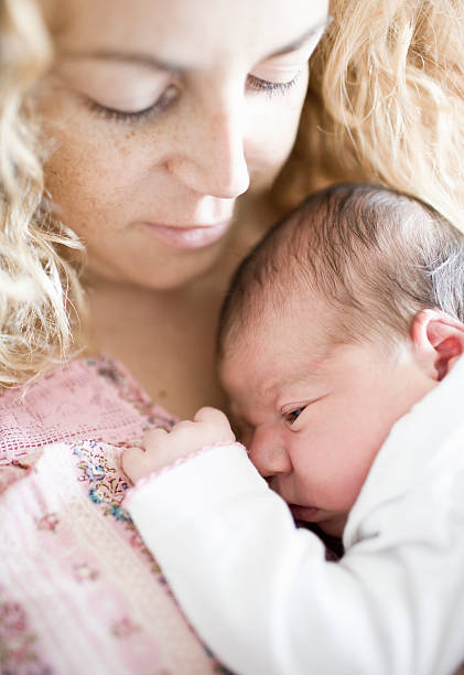 istock Newborn baby with mother 614956176