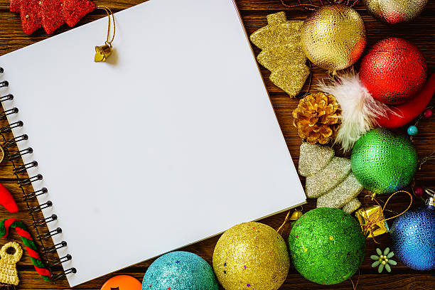 istock Greeting, Blank paper notebook With Christmas decoration on wood 614956596