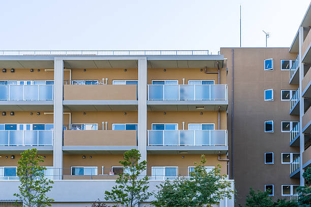 istock Residence image, apartment building against blue sky 614956662