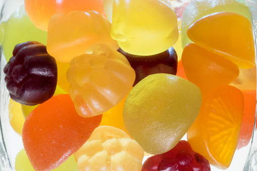 Fruit gummi candies assortment on white