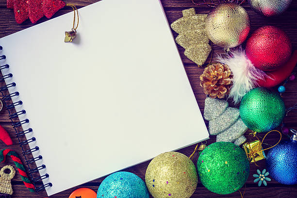 istock Greeting, Blank paper notebook With Christmas decoration on wood 614956942