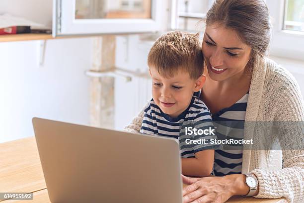 Mother And Son Playing On A Computer Stock Photo - Download Image Now - Mother, Digital Tablet, Computer