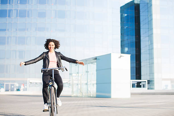istock Beautiful woman enjoying a bicycle ride. 614961268