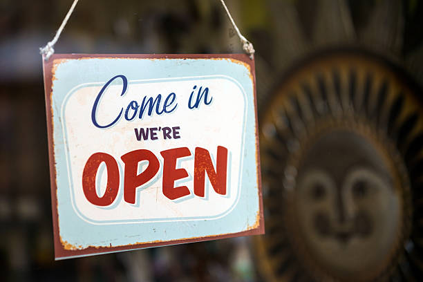 istock Come in we're open sign outside store enter door 614963758