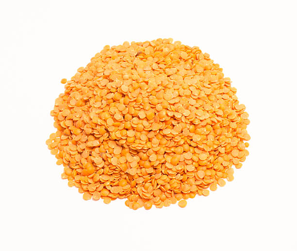 istock the seeds of red lentils on the white background 614965136