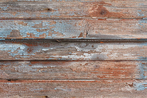 istock Background of old wooden board with cracked red paint 614965740