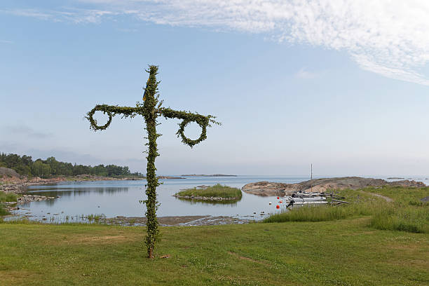 istock Tiny maypole, small harbor and the sea in the background 614968692