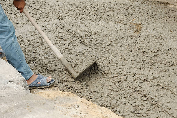 istock Worker pouring cement and adjust during Upgrade walkway 614969618