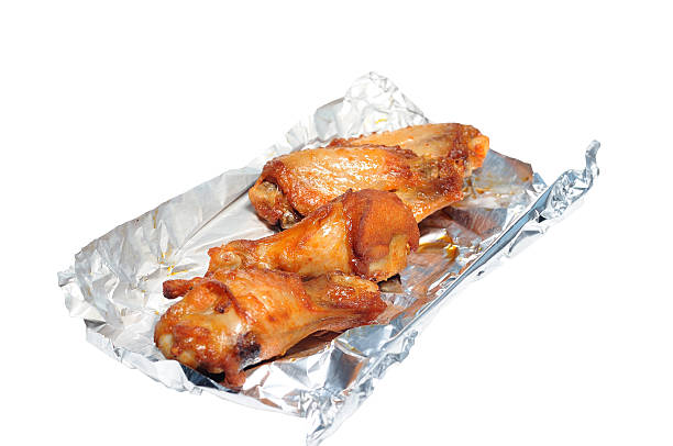 istock Barbecue chicken wings in foil paper 614970168