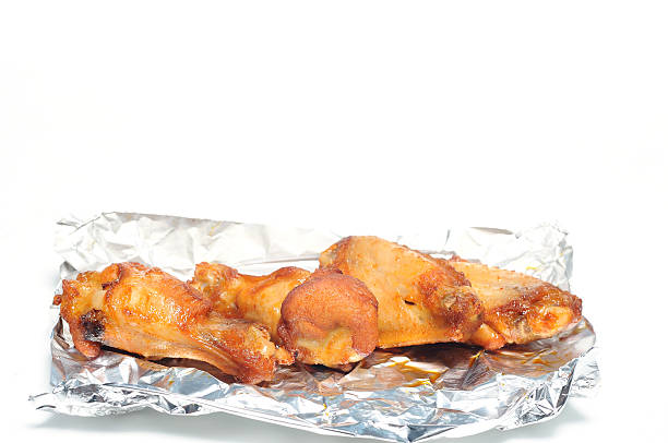 istock Barbecue chicken wings in foil paper 614971226