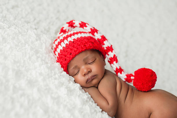 Baby Wearing a Christmas Stocking Cap stock photo
