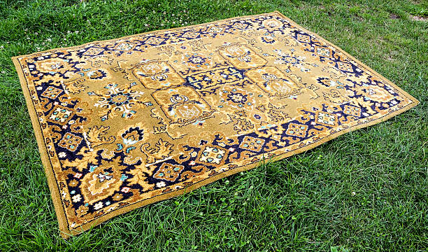 istock Old Persian rug on a green background 614973996