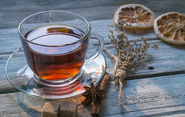 istock Cup of tea and dry twig herb 614974458