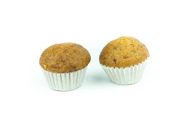 istock Banana muffin cupcakes isolated on white background 614975806