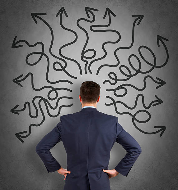 istock Confused business man on wall 614975914