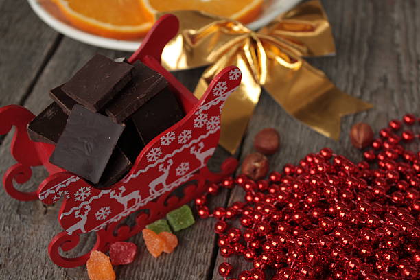 istock red Santa's sleigh with chocolate, hot cocoa with marshmallows 614976426