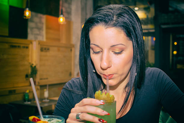 istock Beautiful girl with a cocktail 614977076