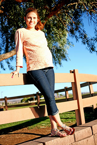 istock Pregnant by a Fence 614977390