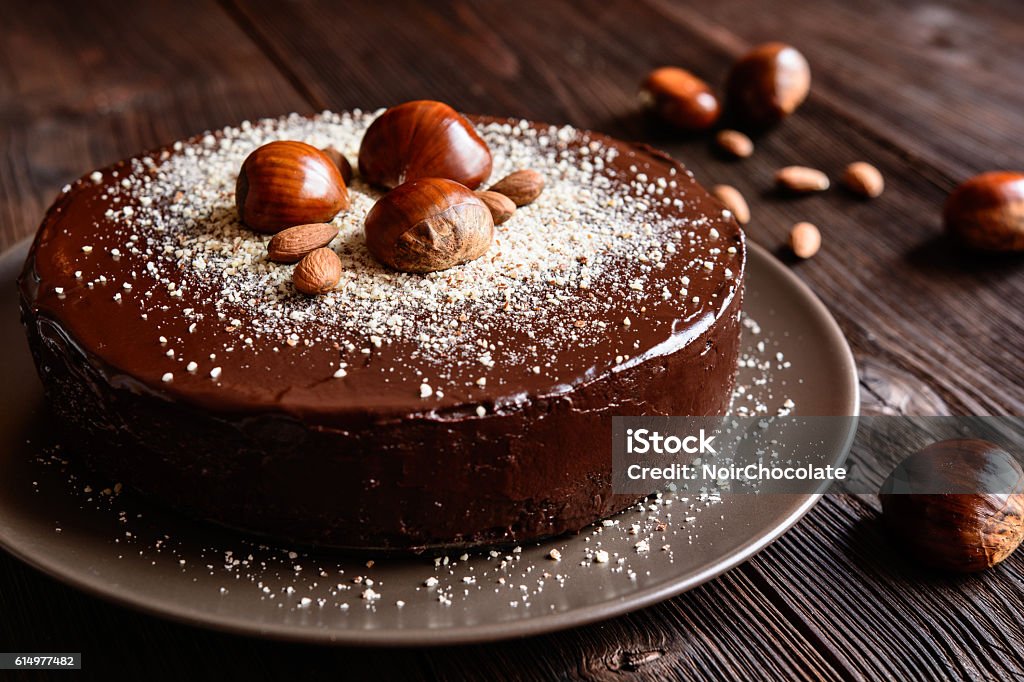 Chestnut cake with almonds and chocolate Delicious chestnut cake with almonds and chocolate glaze Cake Stock Photo