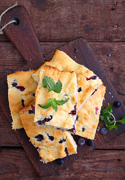 istock cake with blueberries cut into slices on old wooden board 614977516