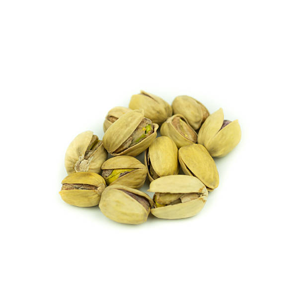 istock Pistachio nuts. Isolated on a white background. 614977922