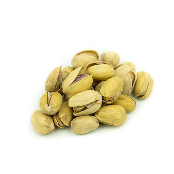 istock Pistachio nuts. Isolated on a white background. 614978126