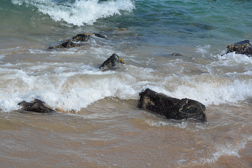 Waves crashing on rocks in Fujeirah, UAE