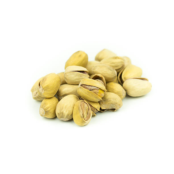 istock Pistachio nuts. Isolated on a white background. 614978336