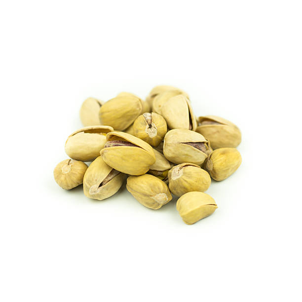 istock Pistachio nuts. Isolated on a white background. 614978392