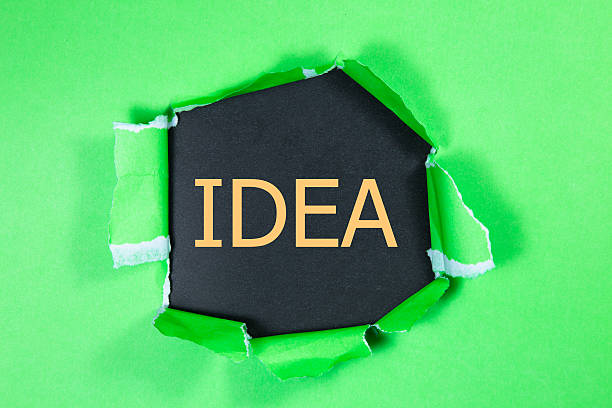 istock The text Idea appearing behind torn green paper 614978580