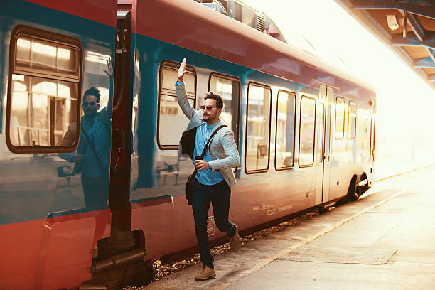 Businessman on railroad station stock photo