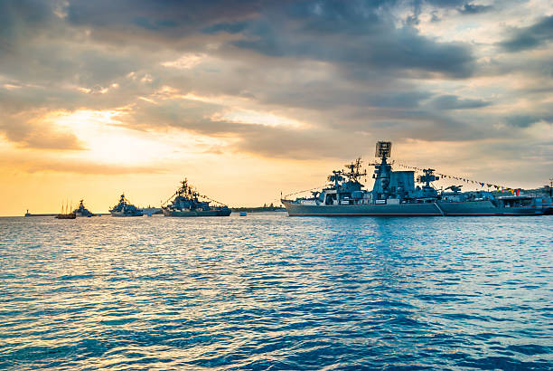 istock Military navy ships in a sea bay 614979082