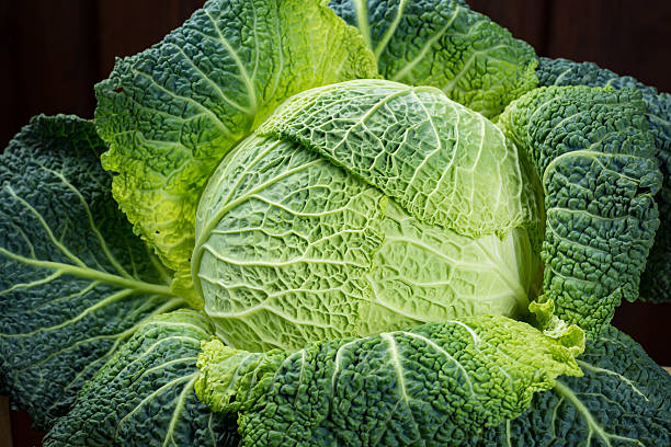 istock Green fresh whole Savoy cabbage close up 614979326