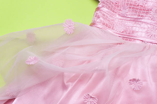 istock Clothes for baby girl on a pink background. Copy space 614979514