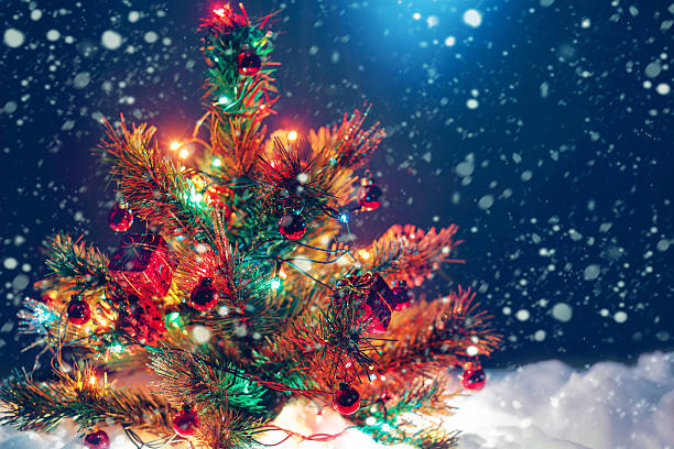 istock Christmas tree with garland of lights and decorations. 614980852