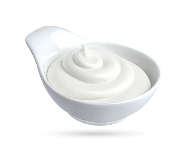 istock Mayonnaise in bowl isolated on white background 614981116
