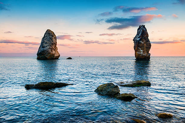 istock Sunset on the sea above big rocks 614981272
