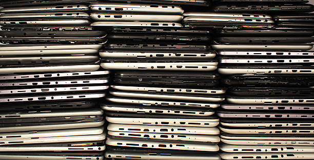 Stacks of disassembled tablets and smartphones stock photo