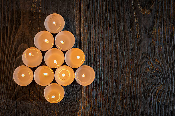 christmas  xmas tree of tealights background rustic wood concept