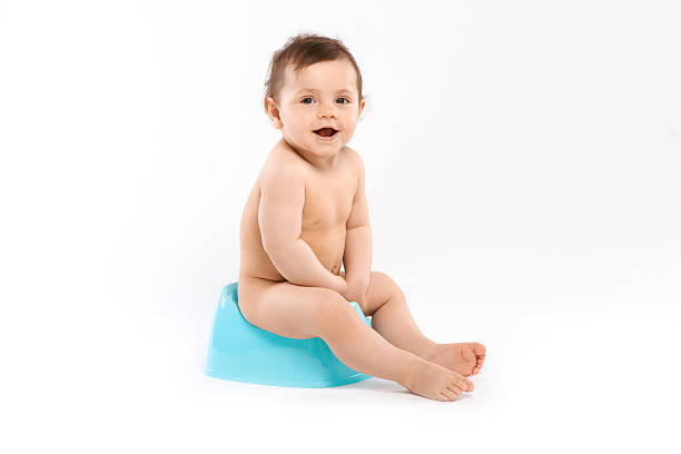 child  on the potty baby smiling and sitting on the potty accustom stock pictures, royalty-free photos & images