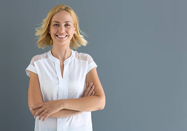 istock Blonde woman smiling 614987498