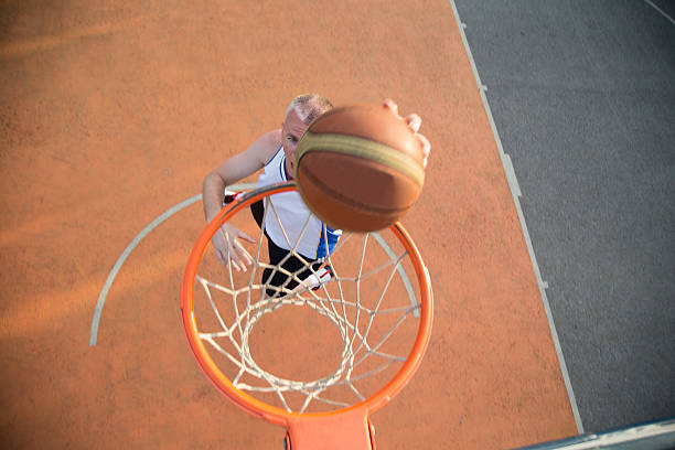 istock Basketball street player making a slam dunk 614987960