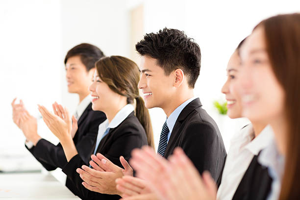 istock happy business people applauding in  conference 614990290