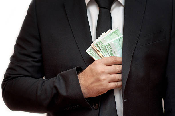 istock Businessman with money in studio 614991162