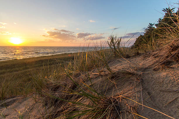 istock Sunset Lake Horizon And Sand Dunes 614992664