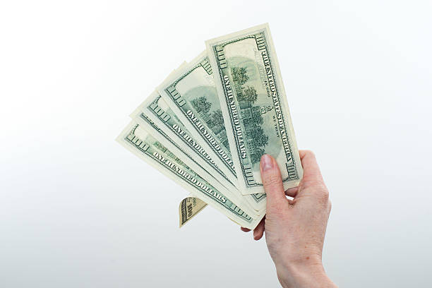 istock girl said 10000 dollars in hand 614996026